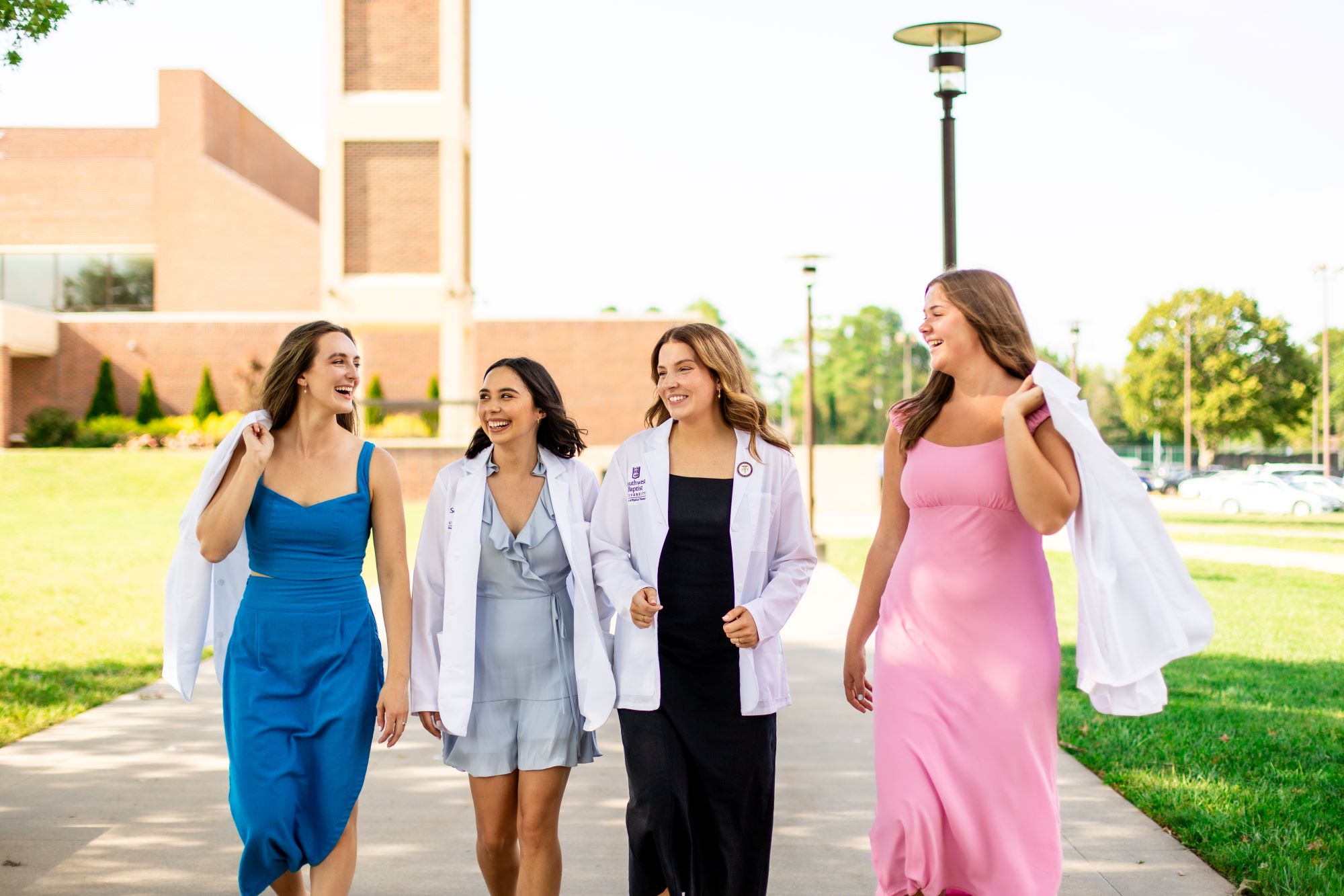 physical therapy students walk together on Bolivar campus